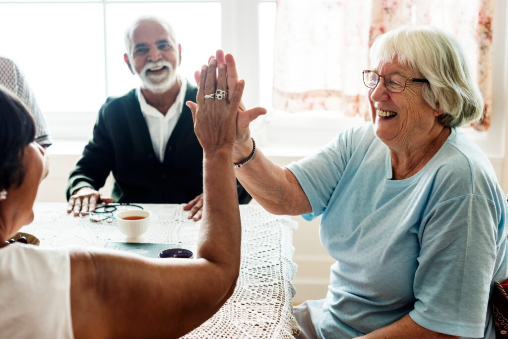 happy seniors enjoying activities at their senior living facility 