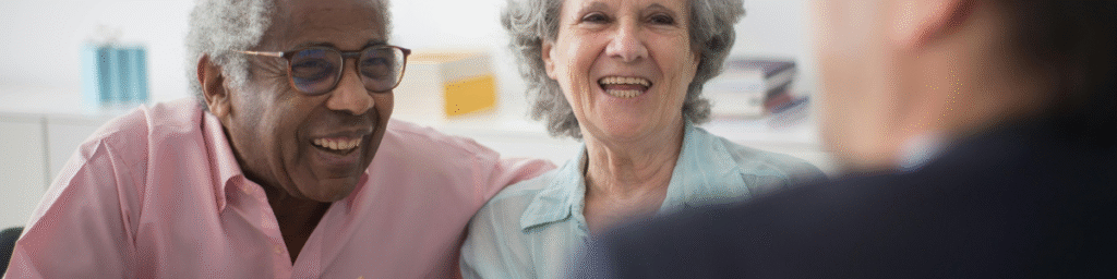 Smiling seniors working with an advisor